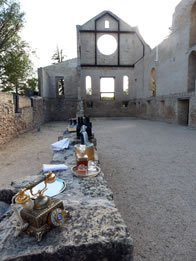 Photo of church ruins wall set up as a bar