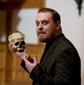 Production picture of Benjamin Curns holding skull