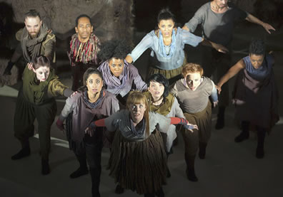 The whole cast, in a flying wedge, eyes upraised