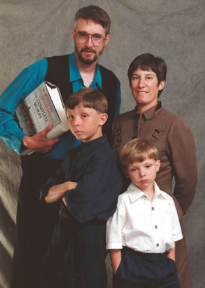 Family portrait where everybody execpt Sarah has a serious expression