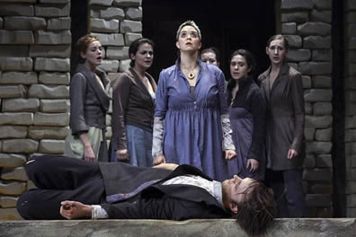 With Orestes lying at the front of the stage, Electra stands over him with the chorus behind