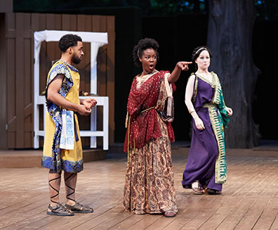 Production photo of Antipholus of Syracuse encountering Adriana and Luciana, who believe him to be the former's husband.