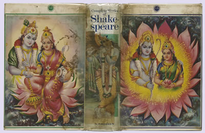 The full front, back, and spine cover, featuring a man and woman in traditional Indian garb amid a bright blooming yellow and pink flower