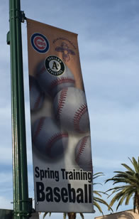 Photo of streetlamp banner of Cubs and A's spring training